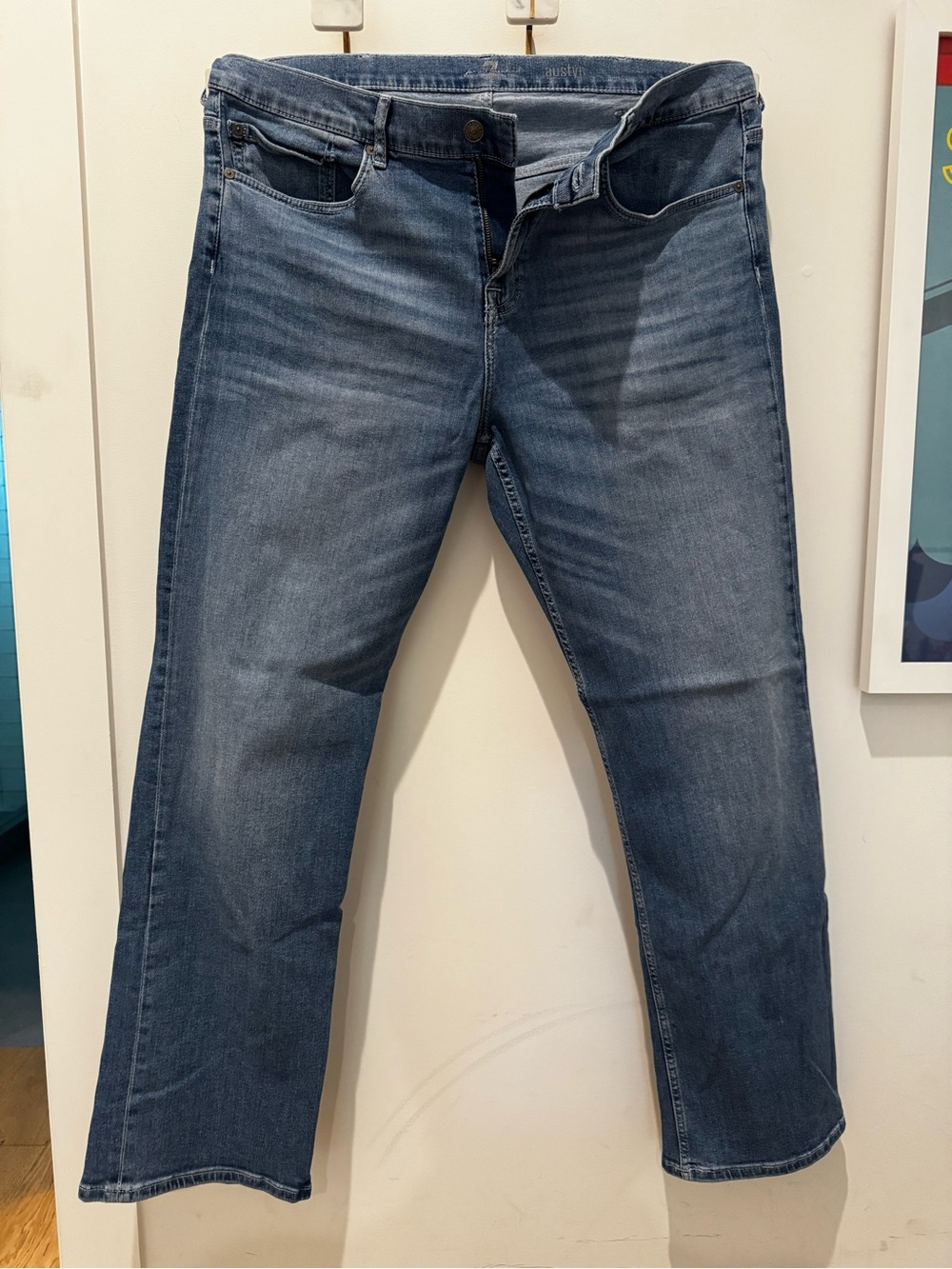 7 For All Mankind faded blue “Austyn” boot cut jeans